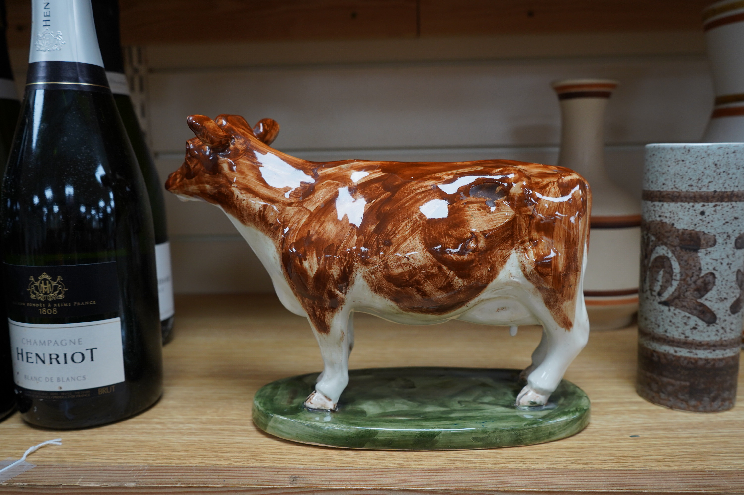 David Sharp, an Ayrshire cow produced for Bayer, and three Cinque Ports Rye vases and a carafe, largest 28cm high. Condition - good